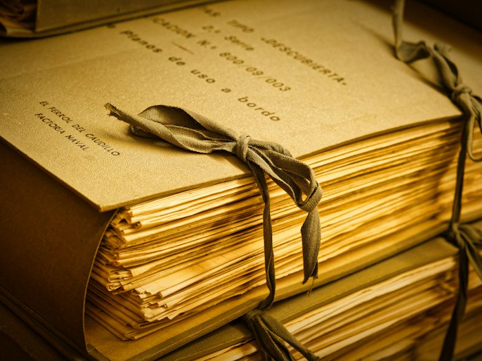Bundle of old documents tied with ribbon, of the kind that turns up in an estate